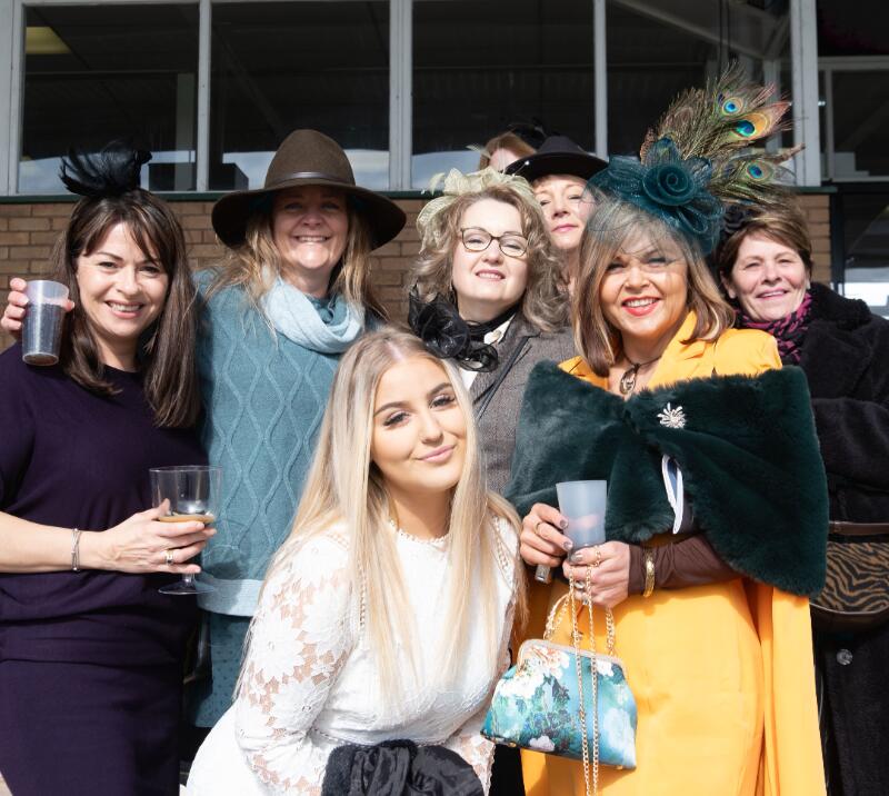A group of well dressed ladies ready for the races at Hereford Racecourse.